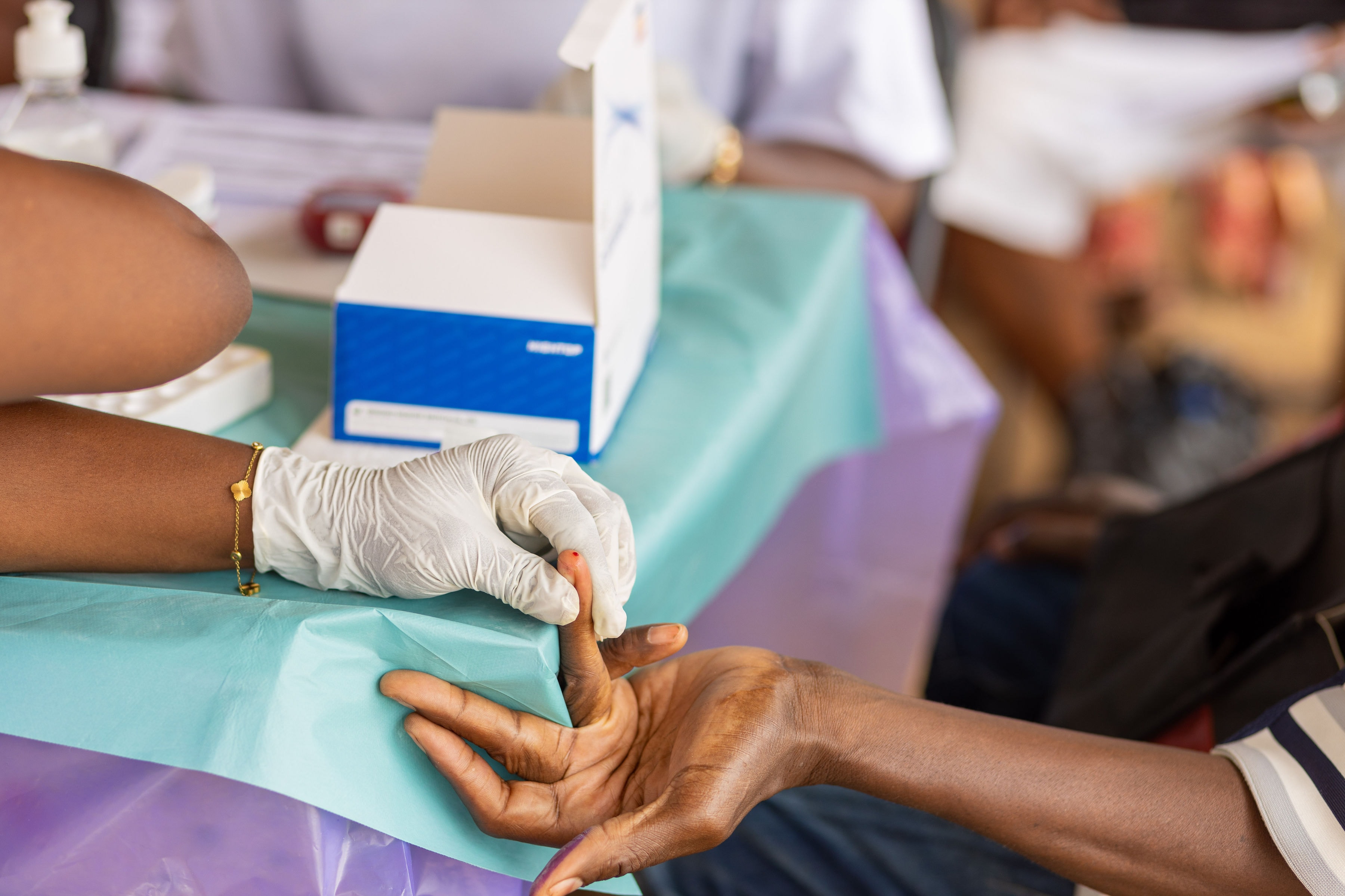 A Care Connect nurse screening a community member